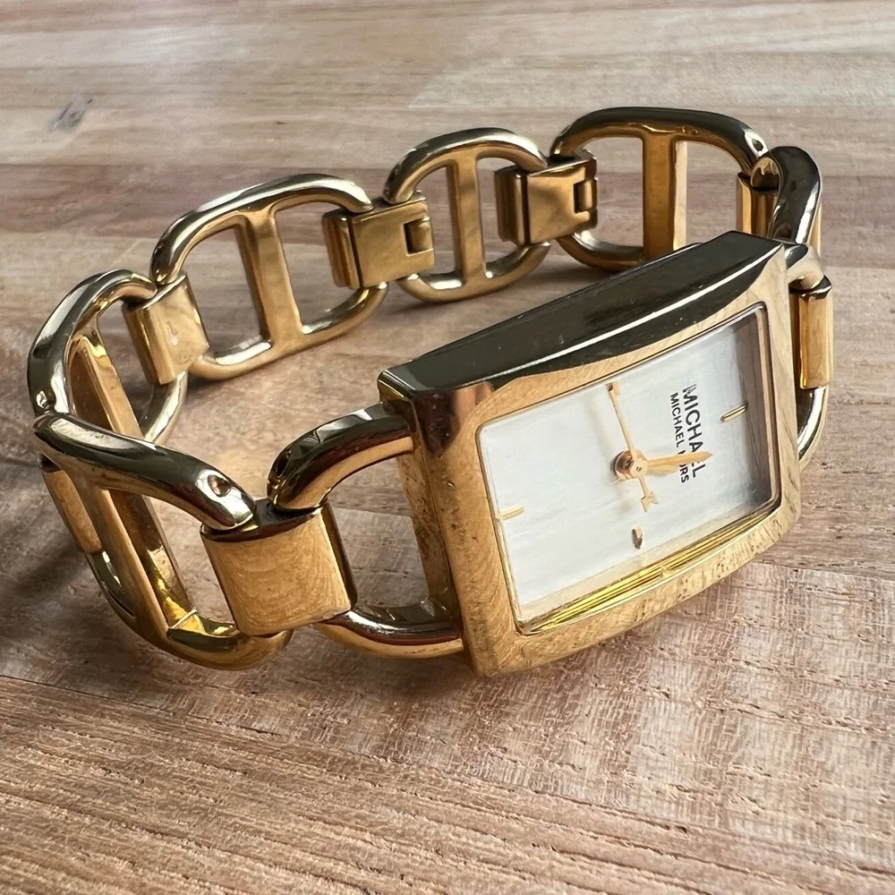Michael Kors ladies rectangular gold tone bracelet dress watch NEW BATTERY
